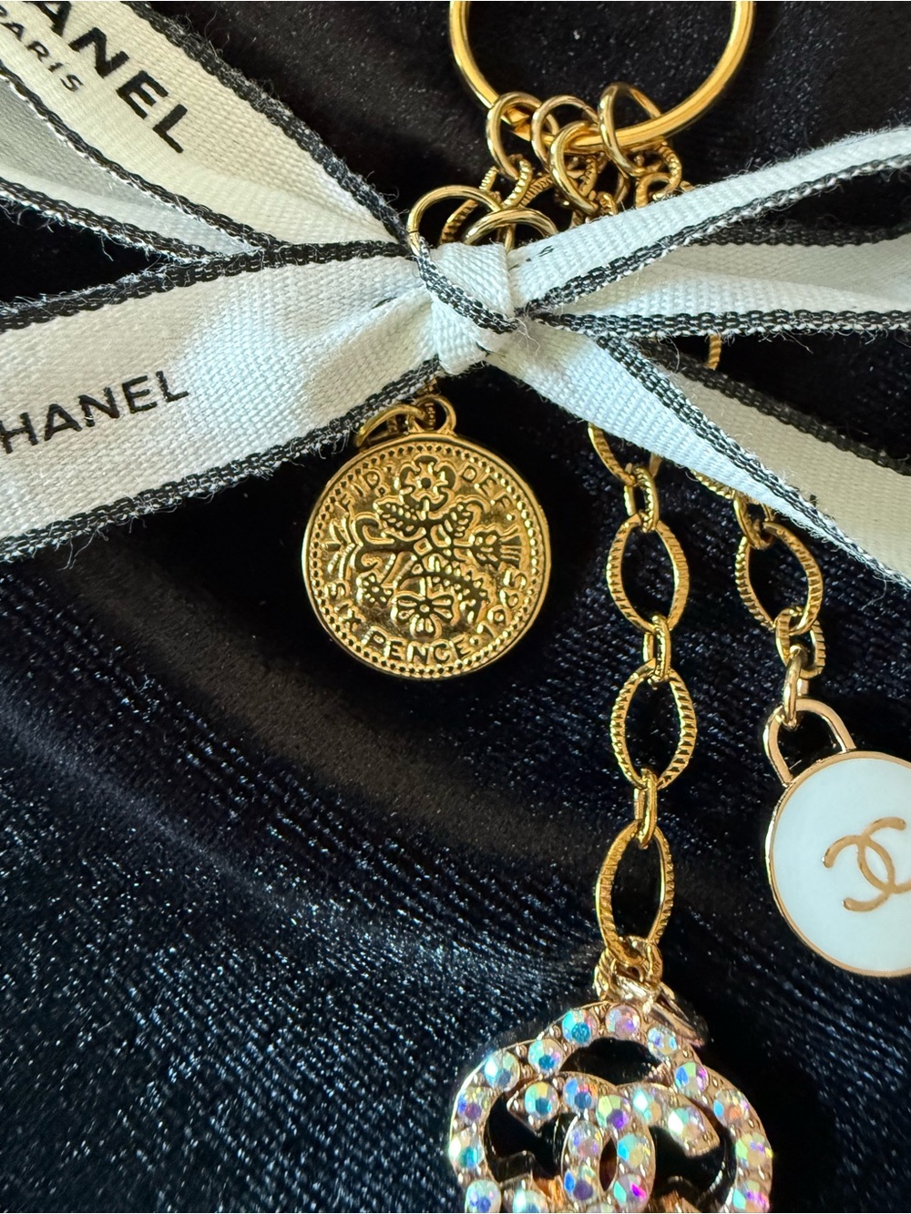 ChaneI Gold-Tone Keyring with White Ribbon and Black Logo and Gold Charms - Picture 9 of 10